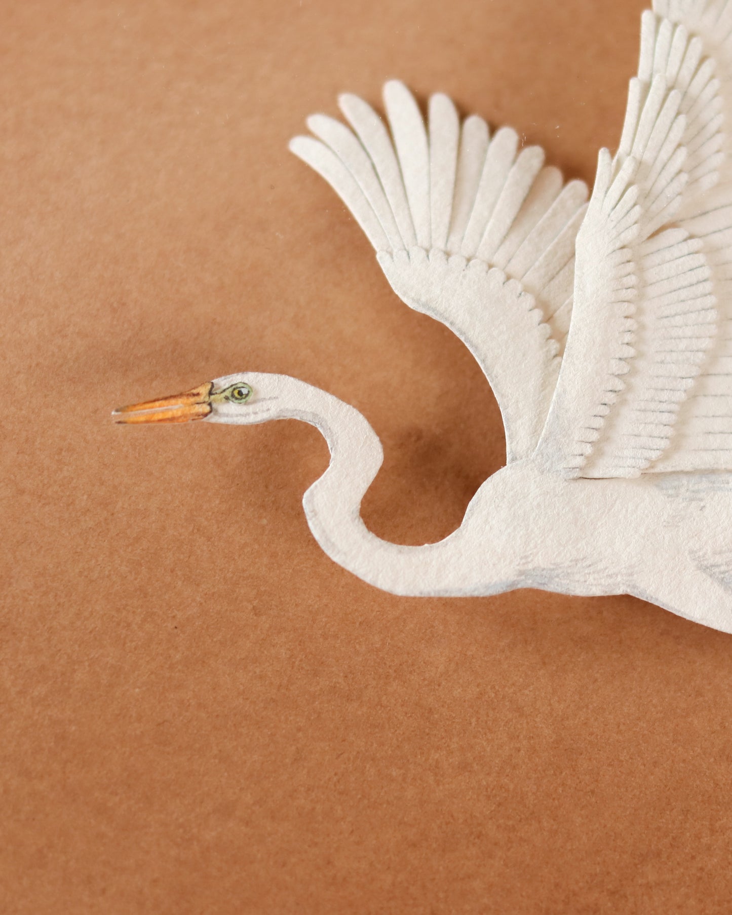 Great Egret flying over dunes